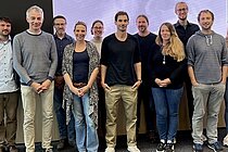 A group of people in a conference room